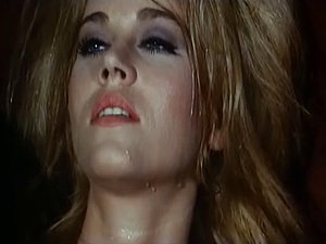 Blonde reaches orgasm in a weird retro porn movie